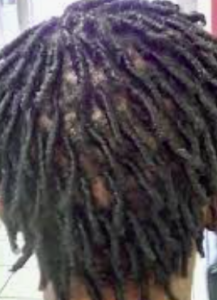 Comb twists on dark brown afro-textured hair.